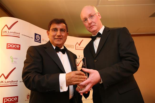 Azad Ayub winner of Green Landlord of the Year award sponsored and presented by Michael Orr Managing Director, The Big Green Energy Company Limited
