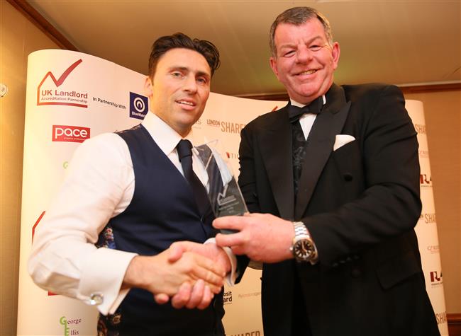Mario Carrozzo Director of Caridon accepts Best Services Provider in the Private Rented Housing Sector presented by Platinum Sponsor Blue Watch (Paul Fuller)