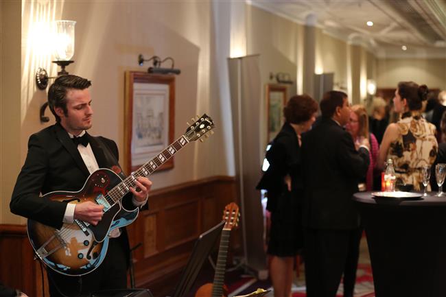 Musician performing during the Champagne Reception