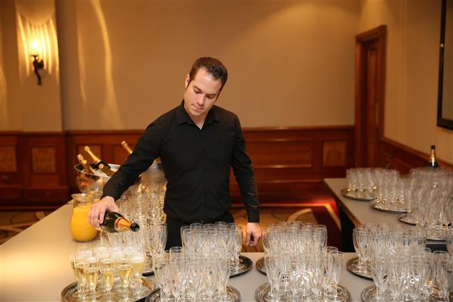 Champagne reception, glasses being filled just as our guests arrive