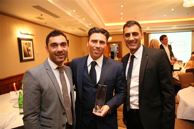 Mario (director) and colleagues from Caridon, with their award share joy