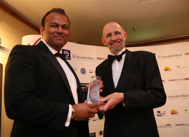 Mr Rohit Nathaniel of Seraphim Housing Group accepts Empowering Tenants Award presented by Alan Ward (Chair, RLA)