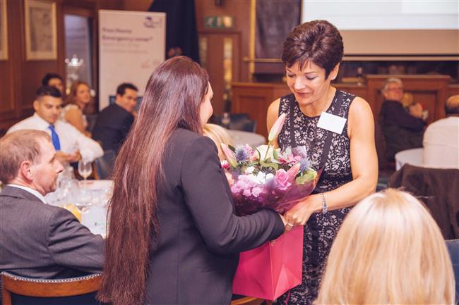 Recognition for Fatima, flowers given by Lisa