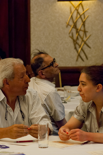 Dr Joung, Chris & daughter paying attention ot the speaker