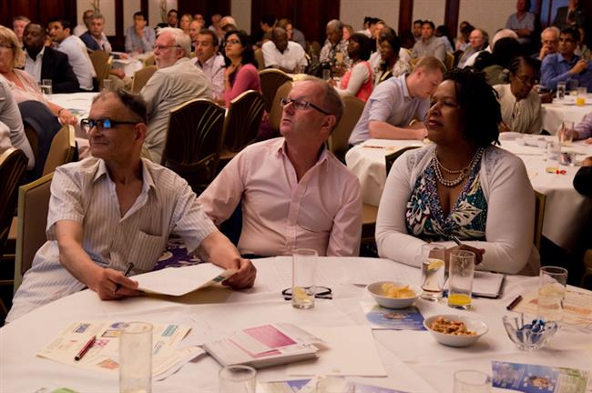 Debbie, Kevin, Dr Young & other guest paying great attention to the speaker